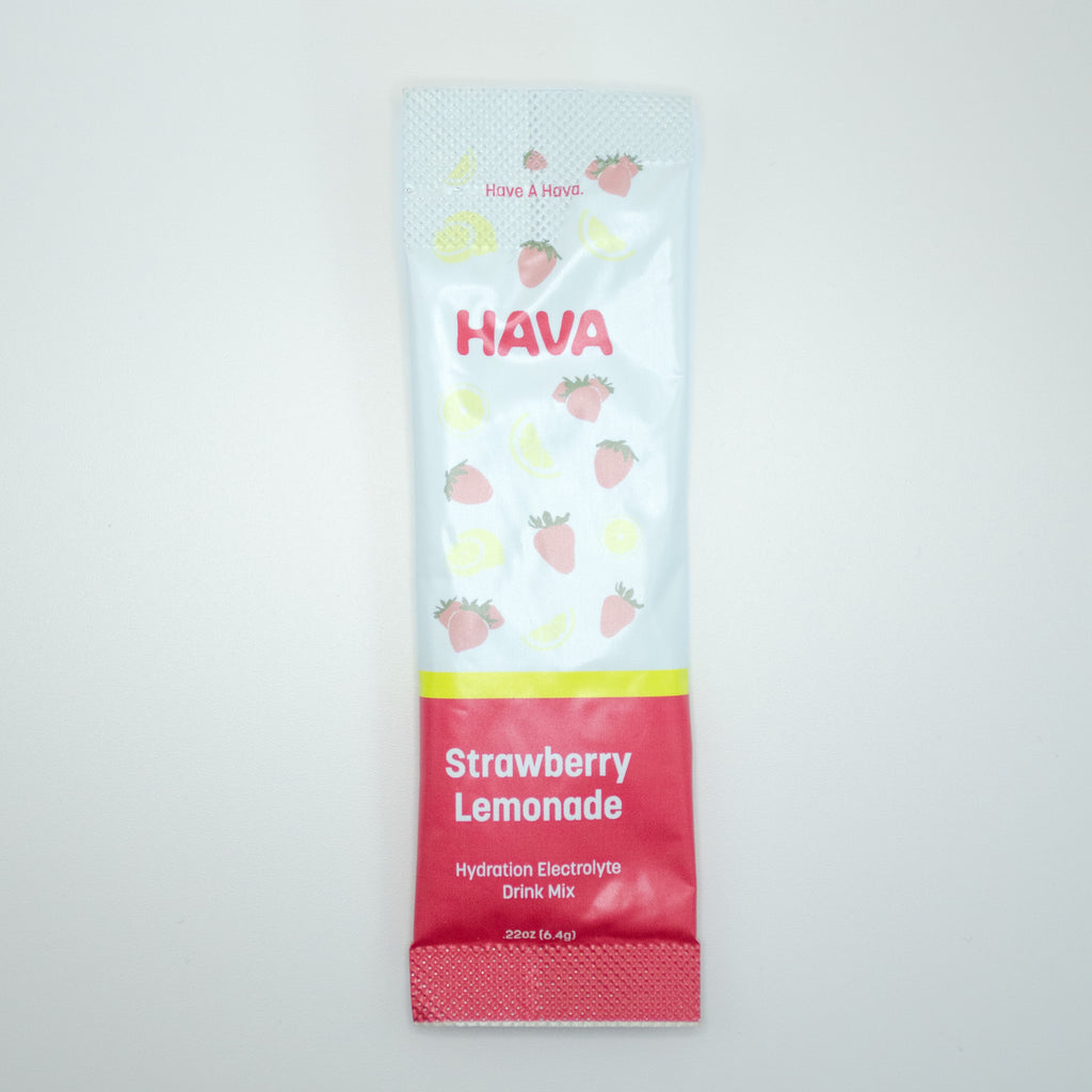 A single packet of HAVA Strawberry Lemonade hydration electrolyte drink mix, featuring a white upper section with strawberry and lemon illustrations and a red lower section, shown on a light gray background.