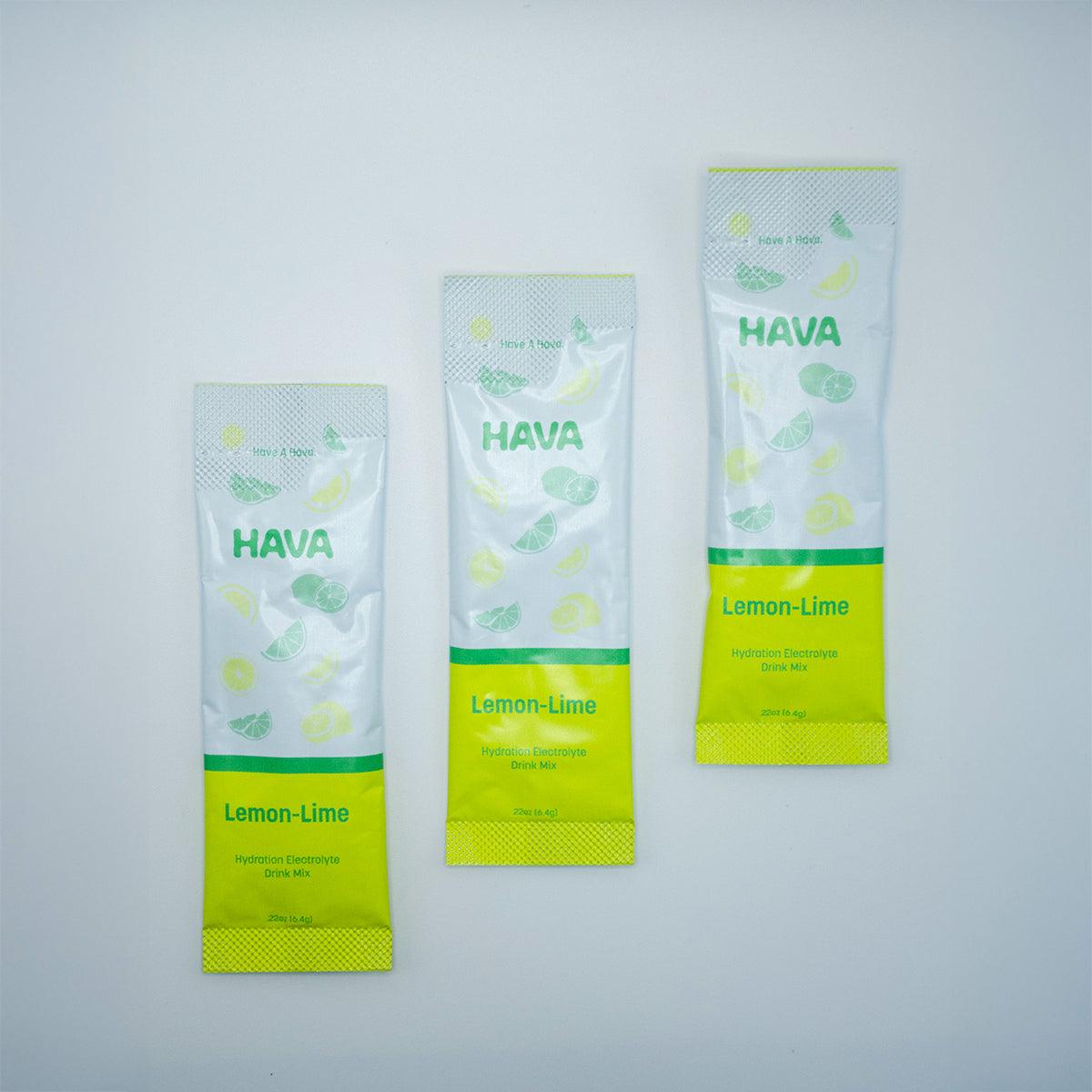 Three HAVA Lemon-Lime flavored stick packs arranged vertically on a light gray background.