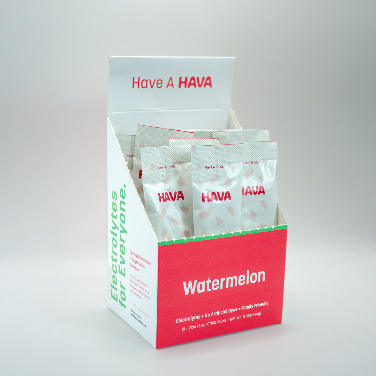 A HAVA brand electrolyte packet display box in watermelon flavor, containing multiple individual packets, photographed on a clean light gray studio background.