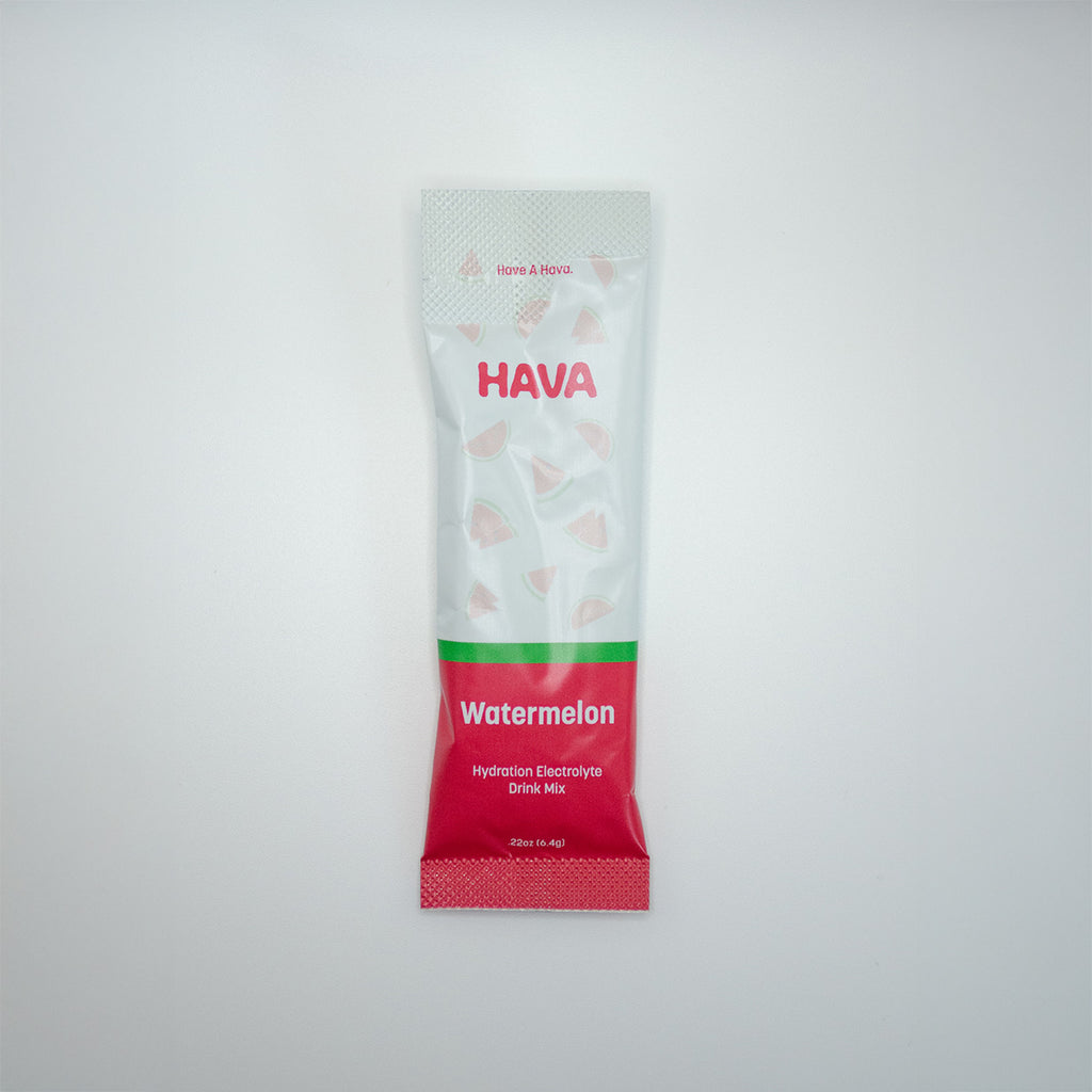 A single packet of HAVA Watermelon electrolyte drink mix, featuring a white and red packaging design with a green stripe, centered on a light gray background.