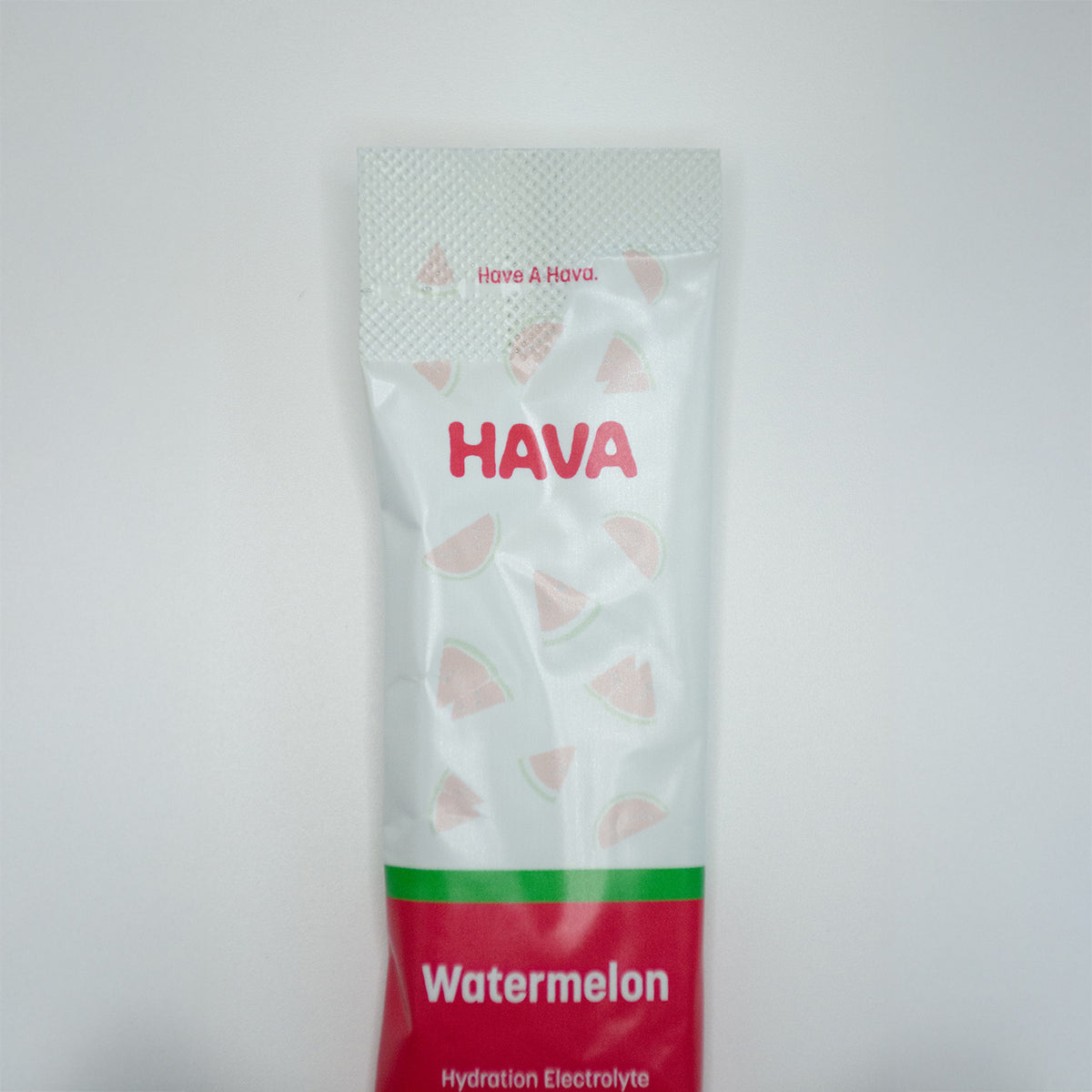 A single packet of Hava Watermelon Hydration Electrolyte powder, featuring a white and red design with watermelon slice illustrations, set against a plain light gray background.