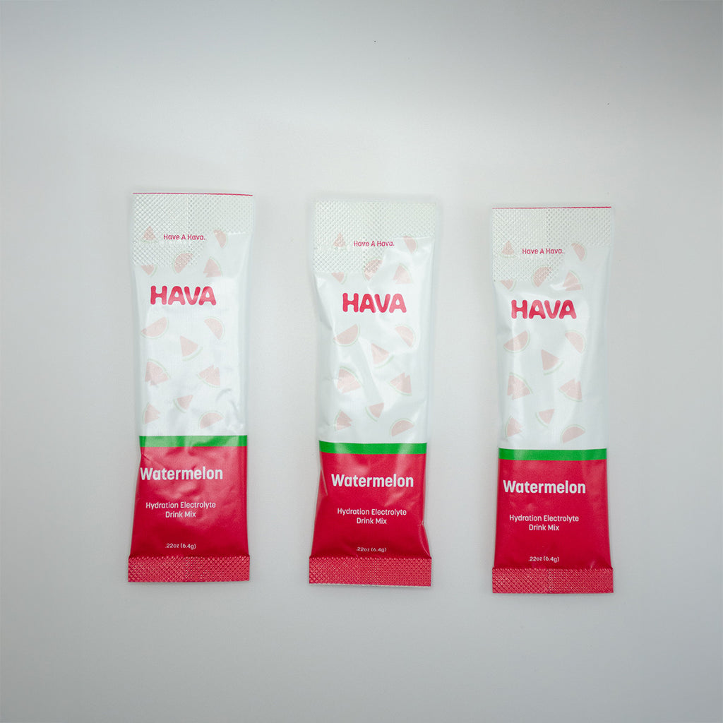 Three Hava Watermelon hydration electrolyte stick packs arranged vertically on a light gray background.