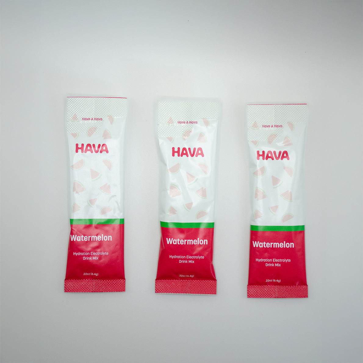 Three Hava Watermelon hydration electrolyte stick packs arranged vertically on a light gray background.